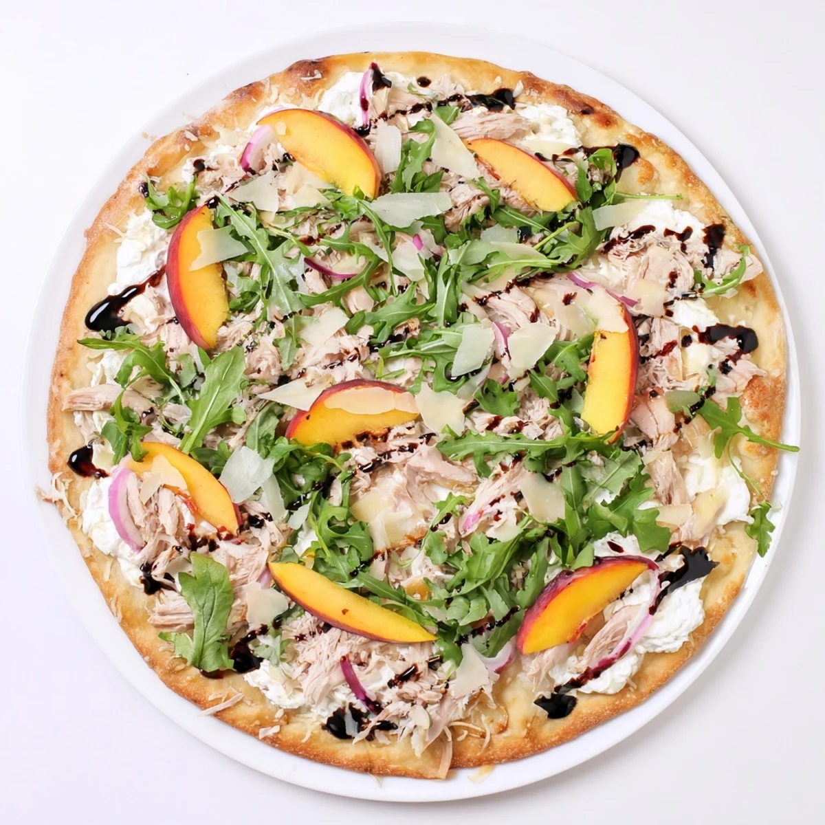 Savory Chicken Peach Ricotta Pizza with sweet peach slices and tangy balsamic finish