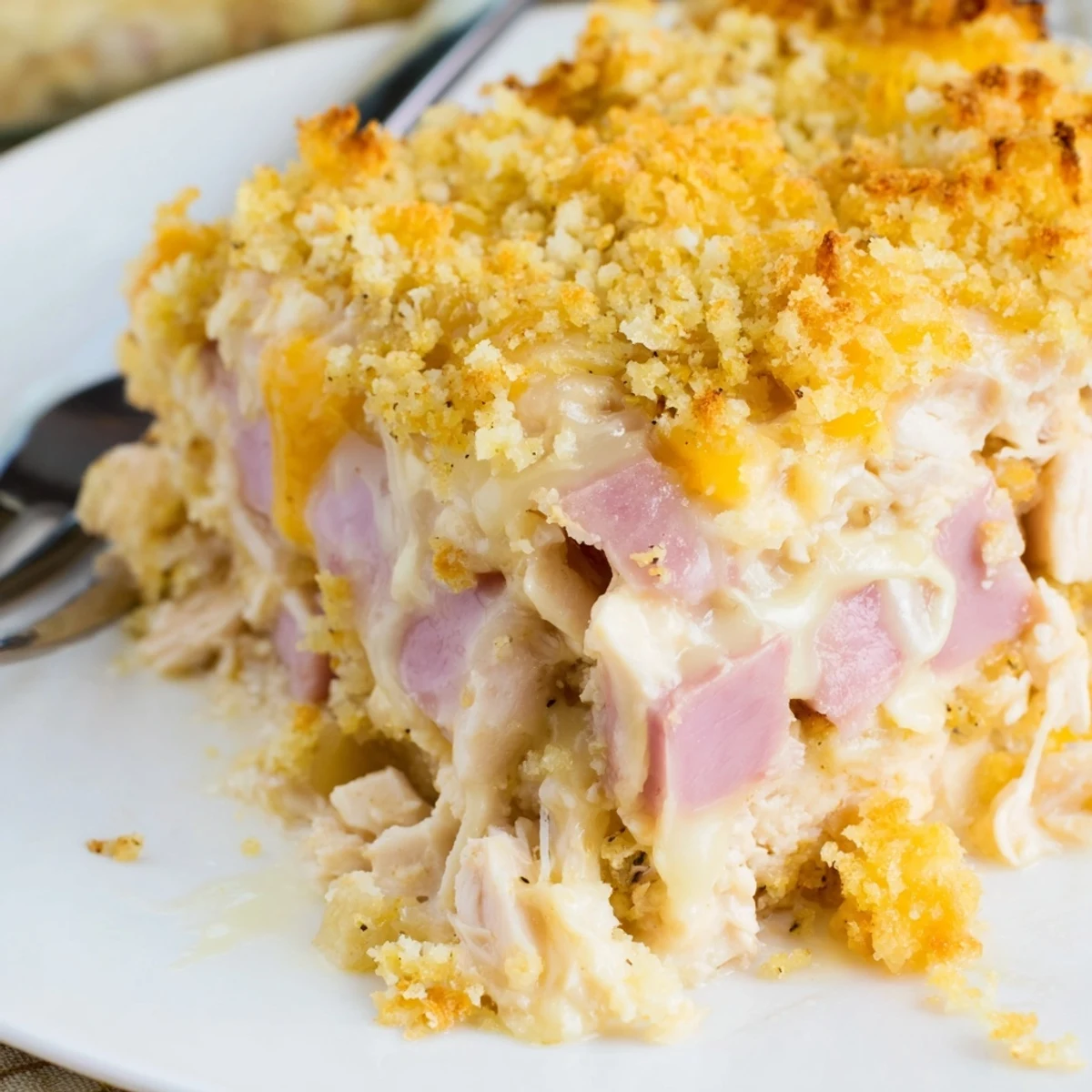 Rich Chicken Cordon Bleu Casserole Recipe bubbling with golden panko and melted Swiss