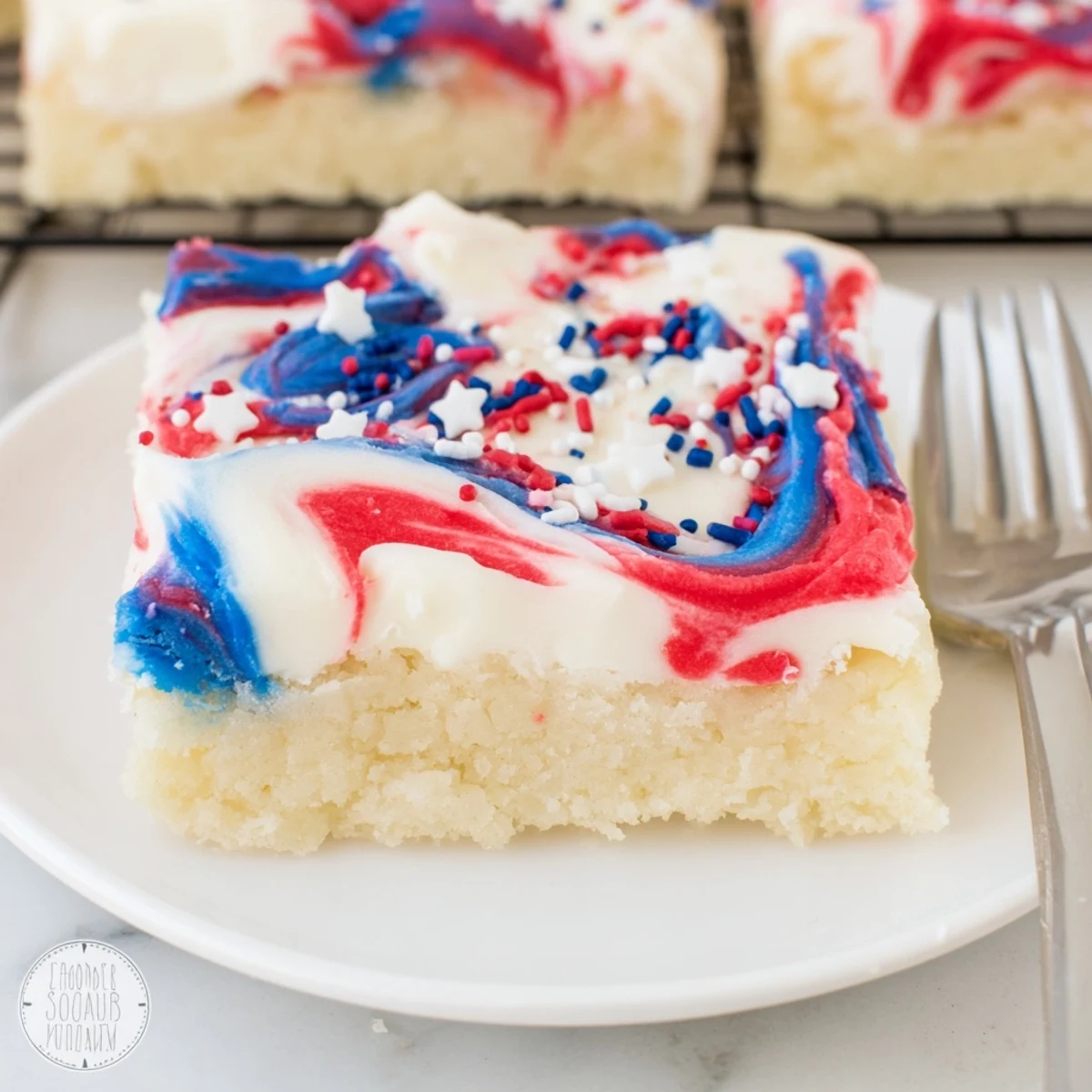 Fresh Patriotic Sugar Cookie Bars on parchment, buttery aroma and sprinkled stars