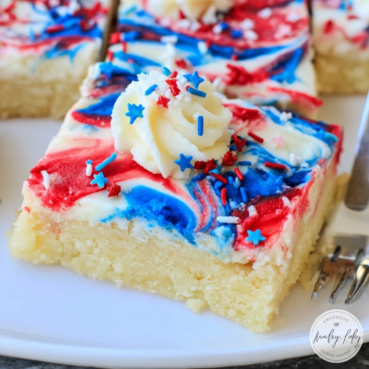 Soft, buttery Patriotic Sugar Cookie Bars arranged with bright sprinkles, ready to serve