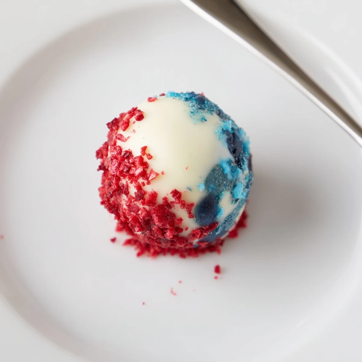 Serving tray with Of July Truffles Creamy And Patriotic dusted with white sprinkles