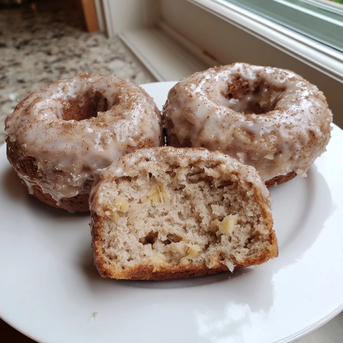 Fresh Banana Donuts cooling on a wire rack, golden tops, sweet aroma