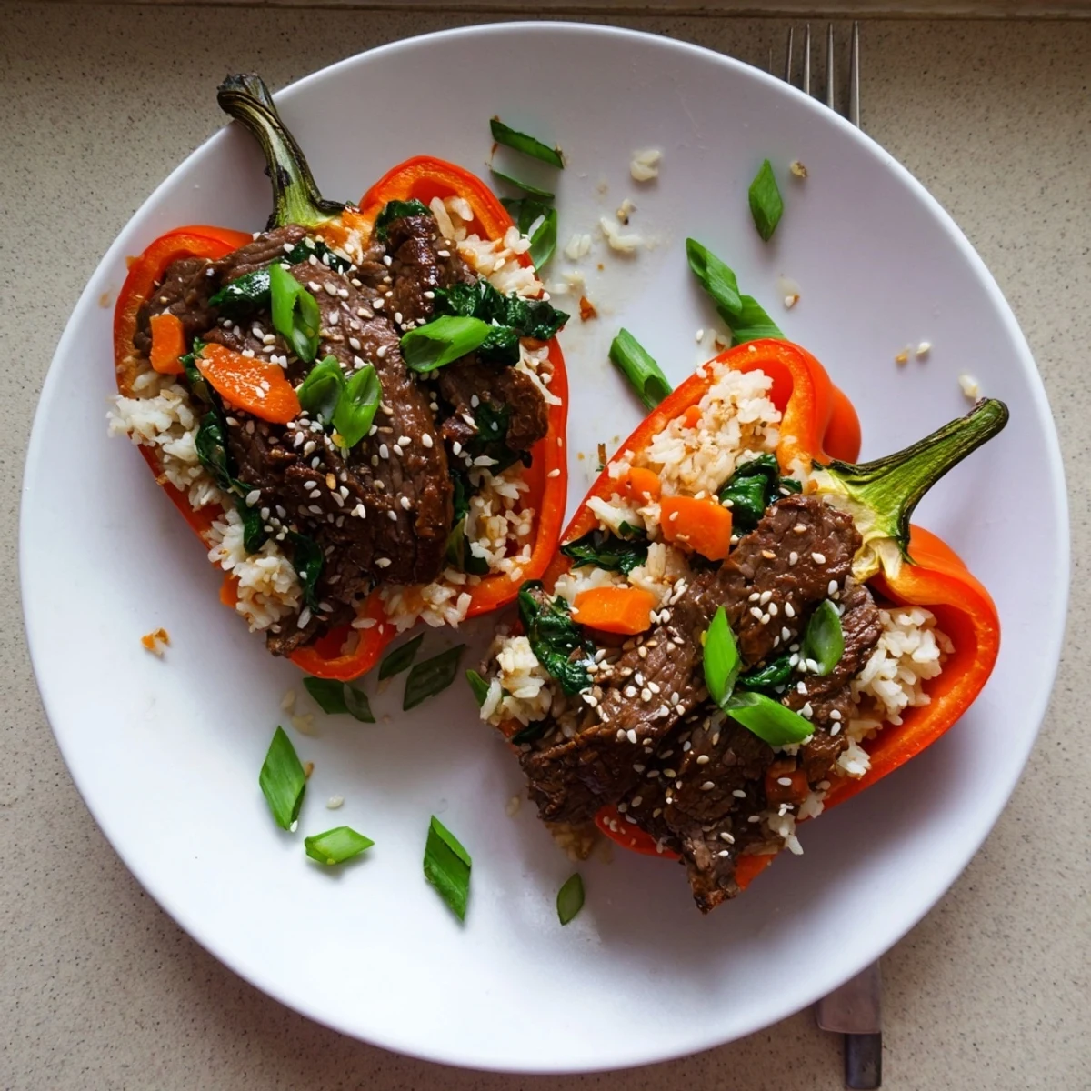 Golden roasted bell peppers overflowing with savory Korean beef bulgoli and fluffy seasoned rice