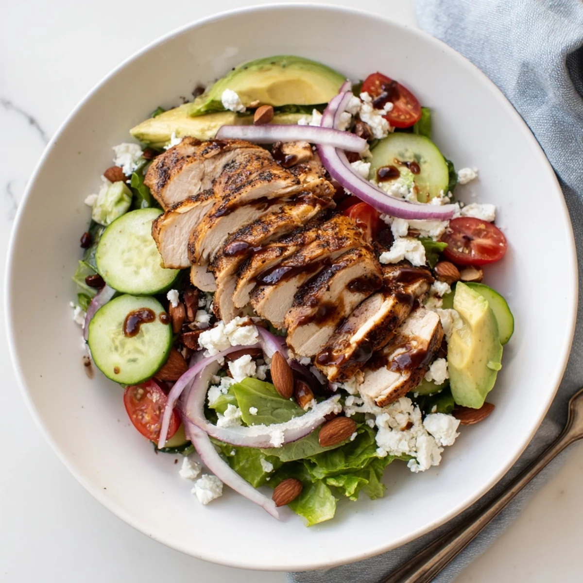 Wholesome Grilled Chicken Salad Recipe served in a bowl with grilled strips, crunchy almonds, and balsamic vinaigrette