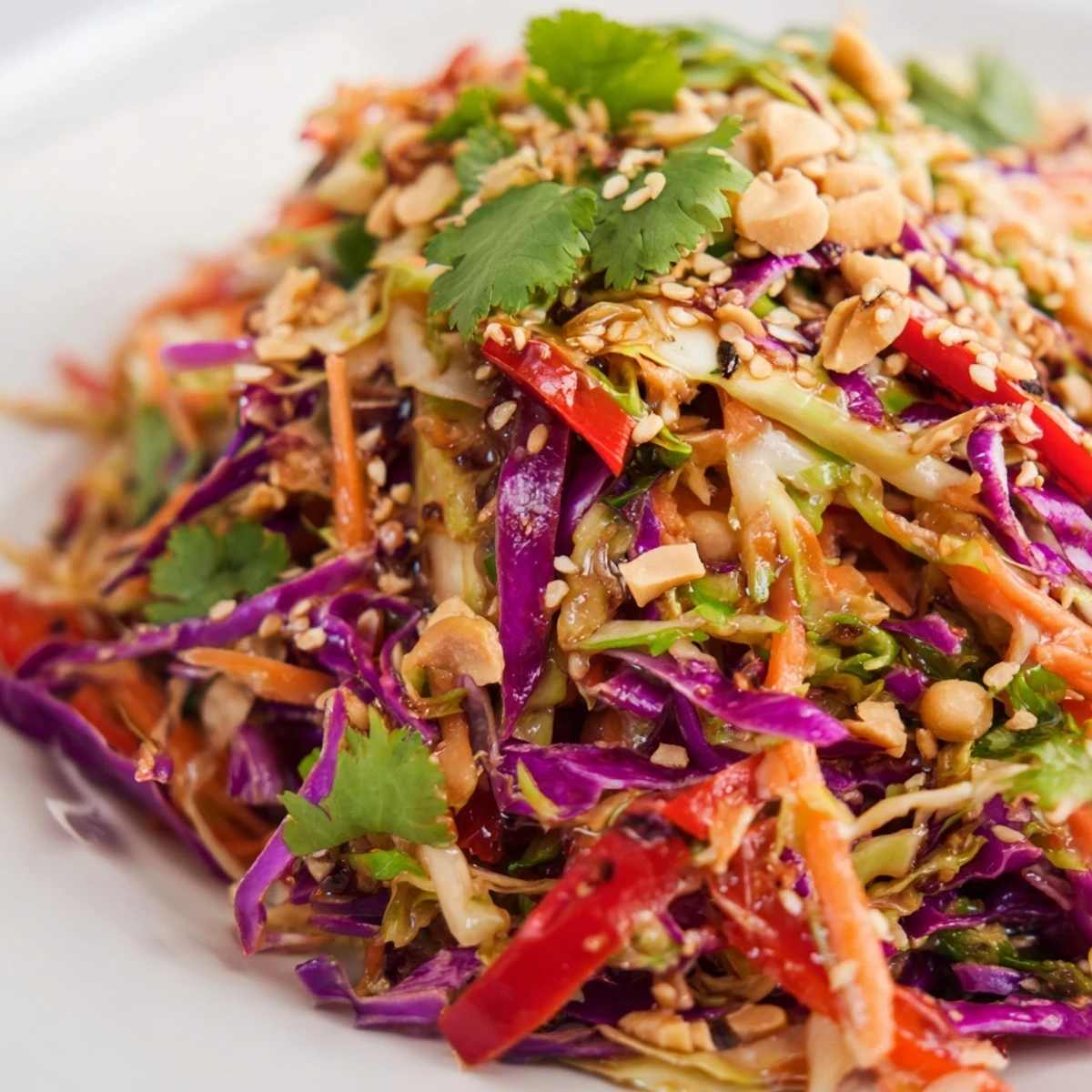Fresh Asian cabbage salad with crunchy red and green cabbage tossed in tangy sesame dressing.