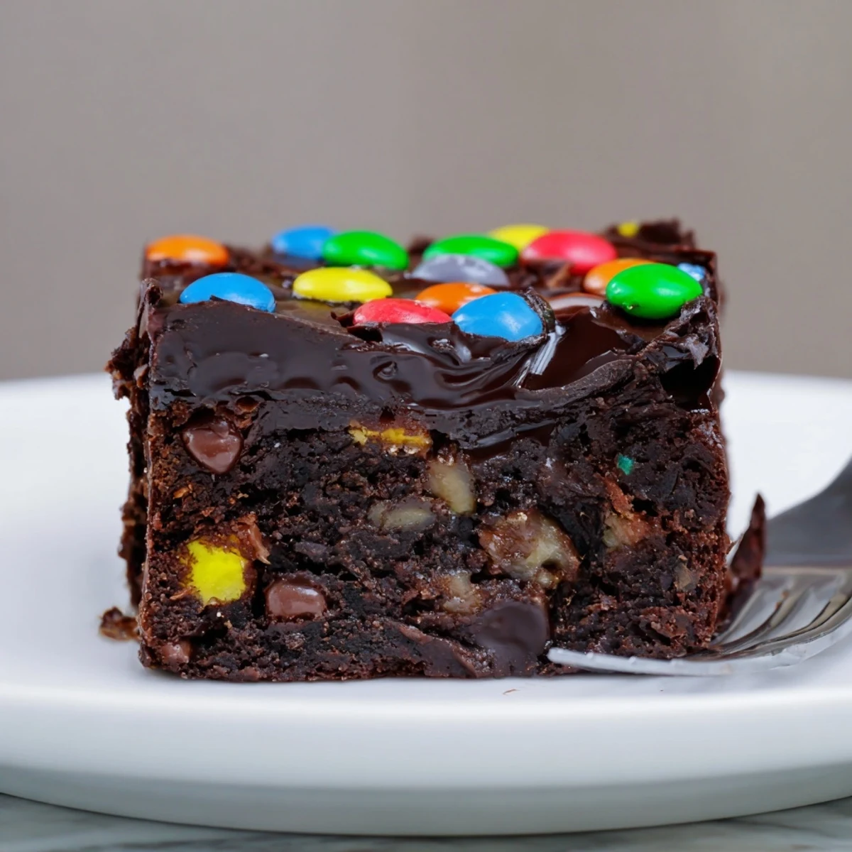 Fudgy Gourmet Cosmic Brownies Bars sliced into squares, glossy ganache and crunchy sprinkles.