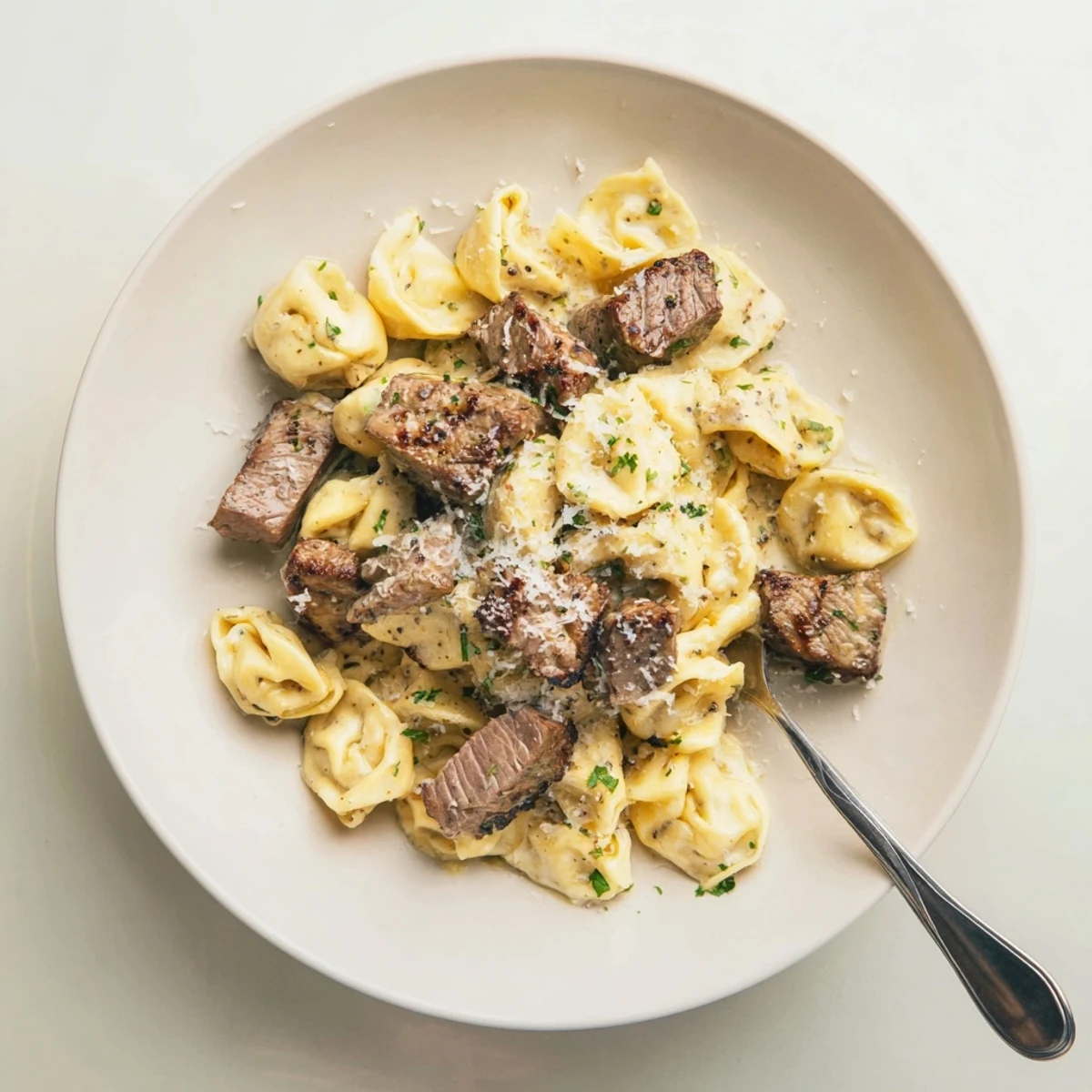 Savory garlic steak tortellini featuring tender beef bites and cheese pasta in a rich sauce