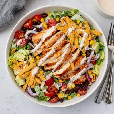Bowl of Spicy Southwest Salad With Spicy Ranch Dressing—zesty lime, creamy heat, fresh cilantro